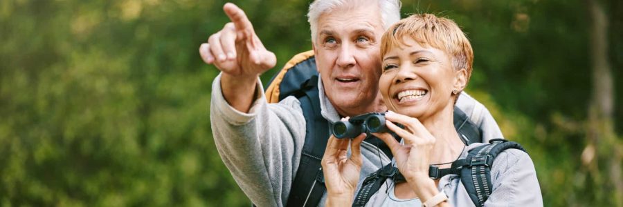 Elderly, couple hiking and fitness, adventure outdoor with hike together, active lifestyle with fre.