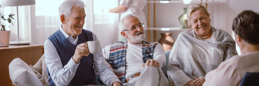 Smiling,Elderly,People,Talking,Together,In,Nursing,Home